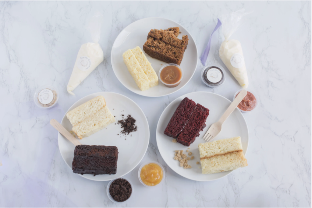 Wedding cake tasting setup with popular wedding cake flavors and wedding cake flavor combinations on white plates.